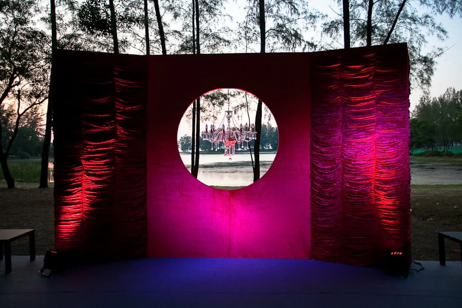 Pink-lit circular wedding entrance installation at a Phuket reception