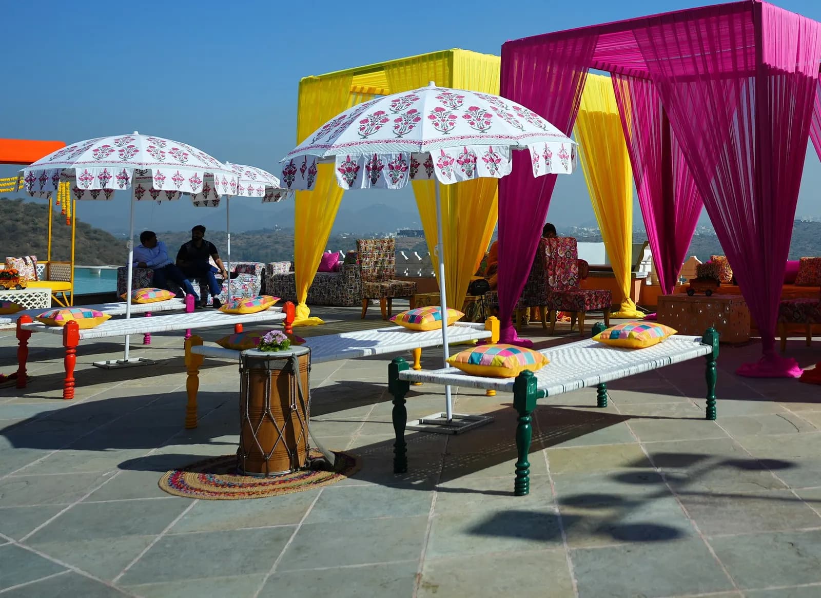 Rooftop dinner setting with a city-and-lake view in Udaipur