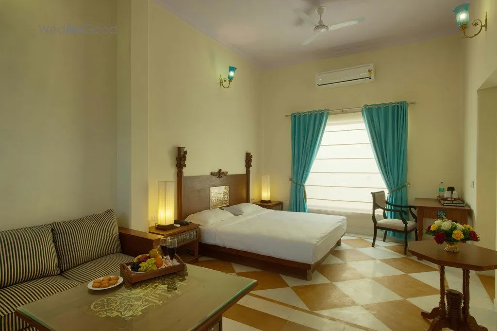 Aaram Baagh themed resort and the Aravalli foothills at golden hour, Pushkar
