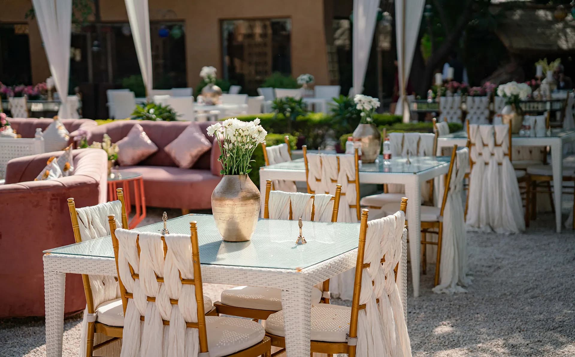 Outdoor garden lawn set with seating and florals for a wedding function at Ajit Bhawan Palace Jodhpur