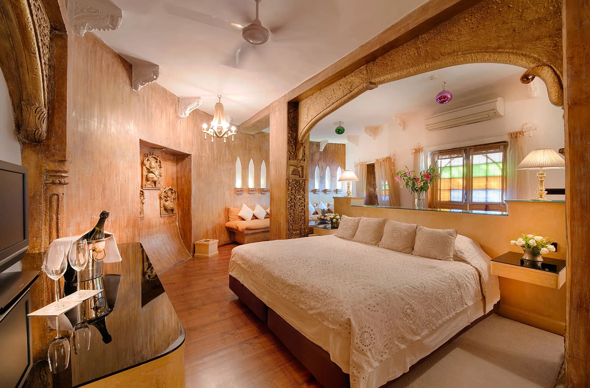 Heritage suite bedroom with carved sandstone arches at Ajit Bhawan Palace Jodhpur