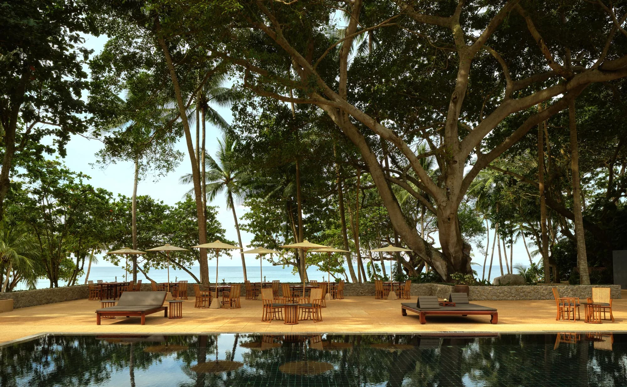 Pool Terrace table set up with Andaman Sea view at Amanpuri, Phuket