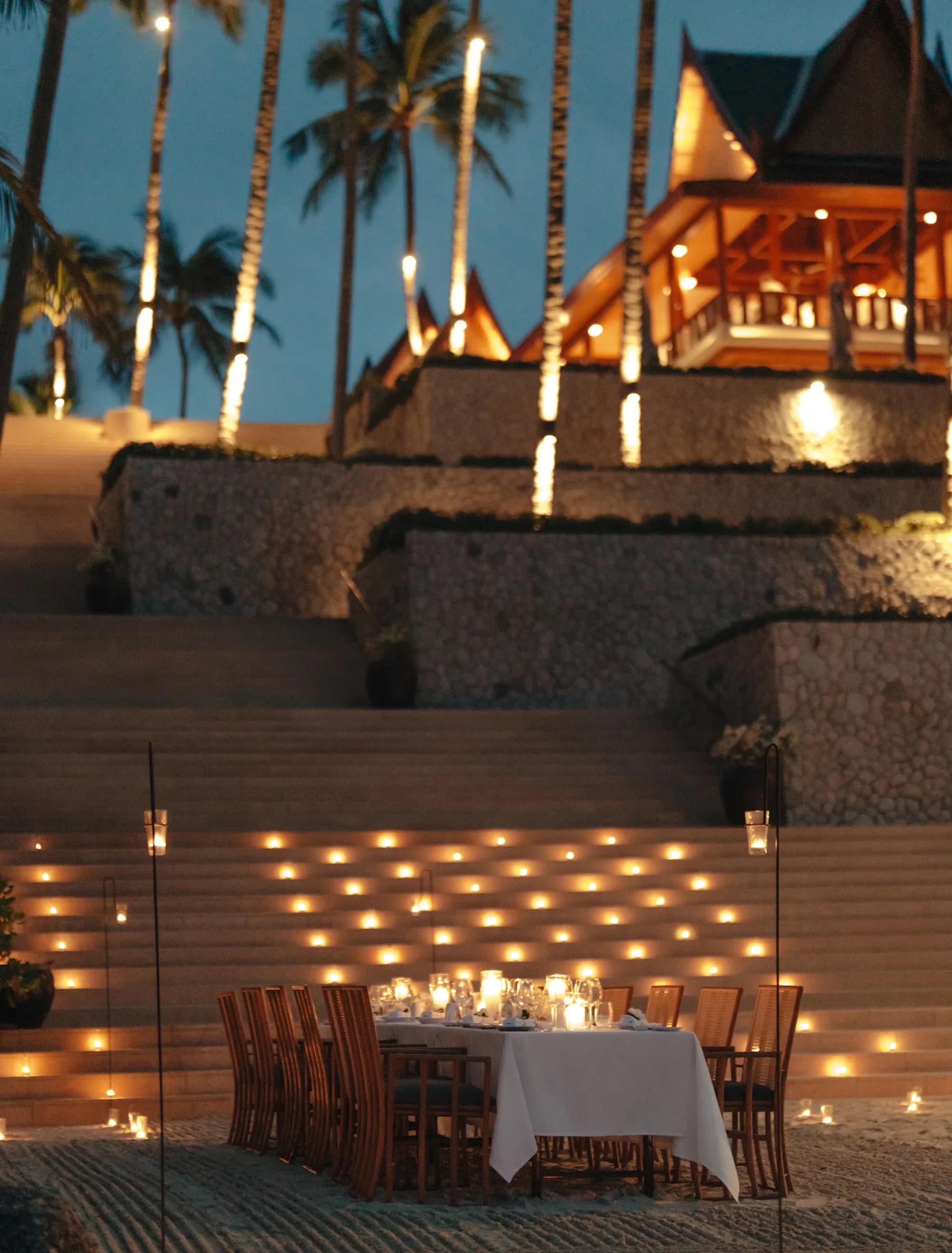 Beach barbecue dinner table setup on the sand at Amanpuri, Phuket
