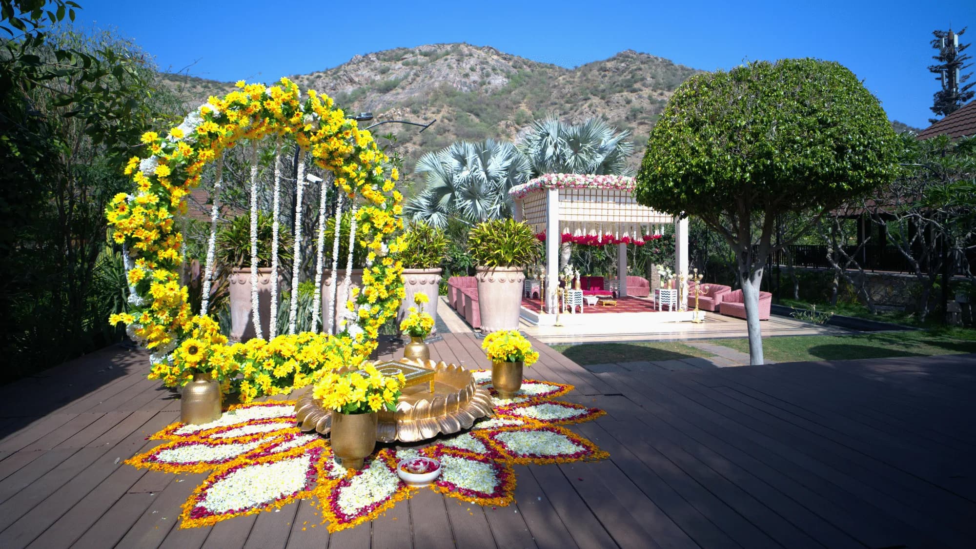 Evening sangeet celebration with stage and lighting on the Big Lawn at Ananta Spa & Resort Pushkar