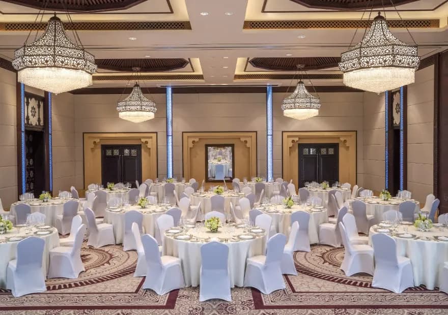 Liwa Ballroom set for a gala dinner with Arabian chandeliers at Anantara Qasr Al Sarab, Abu Dhabi
