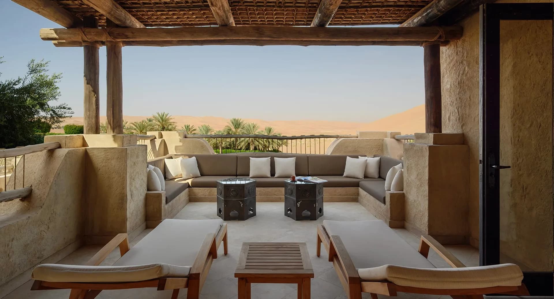 Deluxe terrace guest room with desert view and Middle Eastern decor at Anantara Qasr Al Sarab, Abu Dhabi