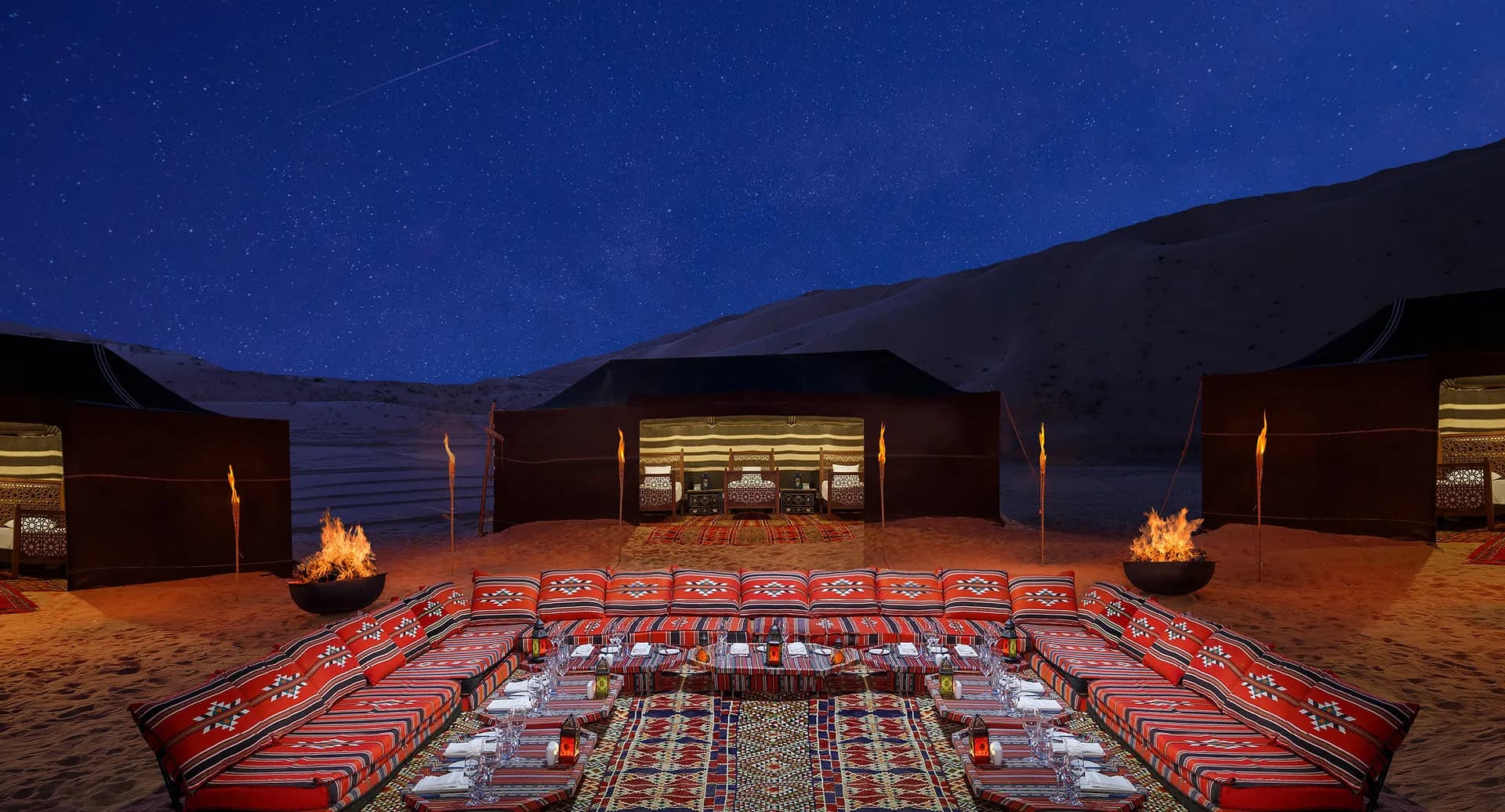 Camp Nujum desert camp majlis lit at night for dinner under the stars at Anantara Qasr Al Sarab, Abu Dhabi