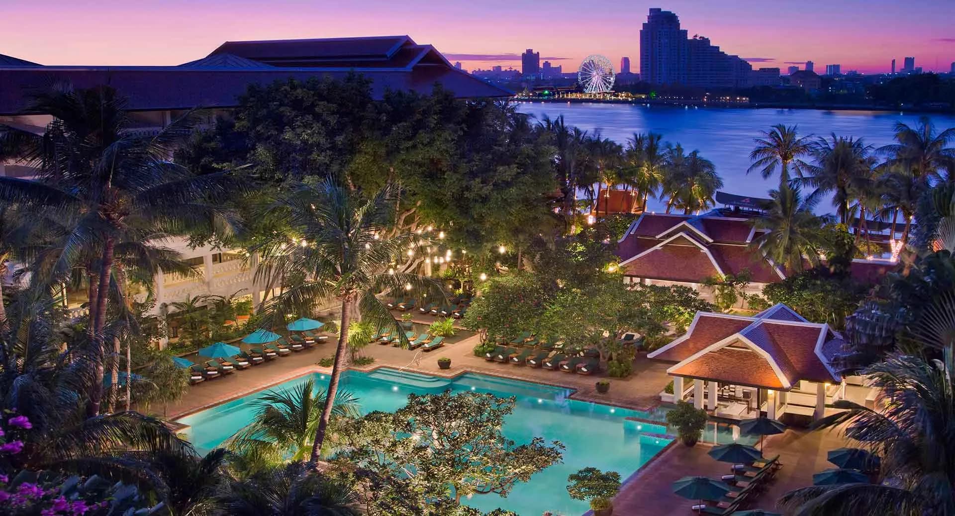 Anantara Riverside Bangkok Resort exterior and low-rise riverfront buildings on the west bank of the Chao Phraya River