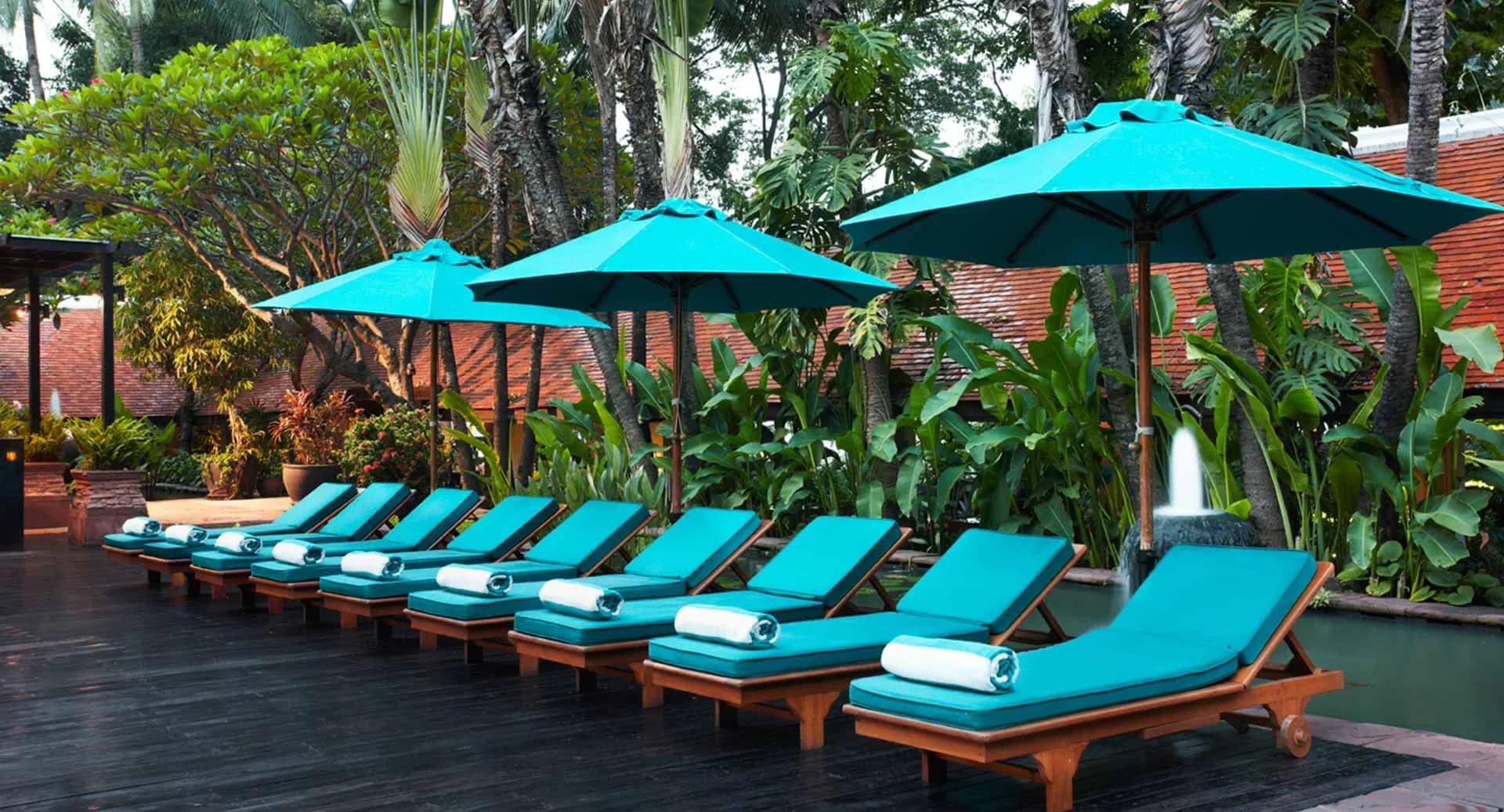 Swimming pool and riverside pool deck overlooking the Chao Phraya River at Anantara Riverside Bangkok Resort