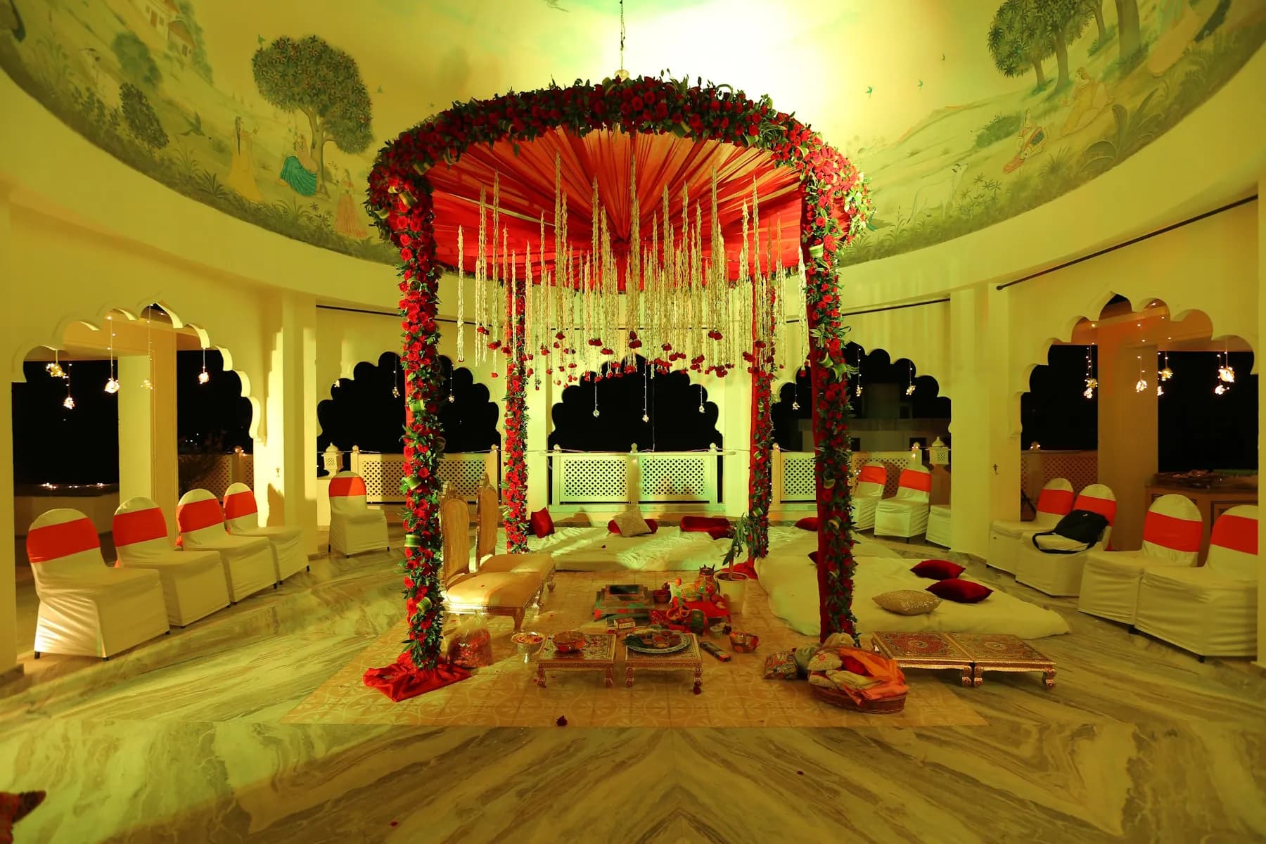Open banquet lawn set for a wedding celebration against the white haveli at Anuraga Palace Ranthambore