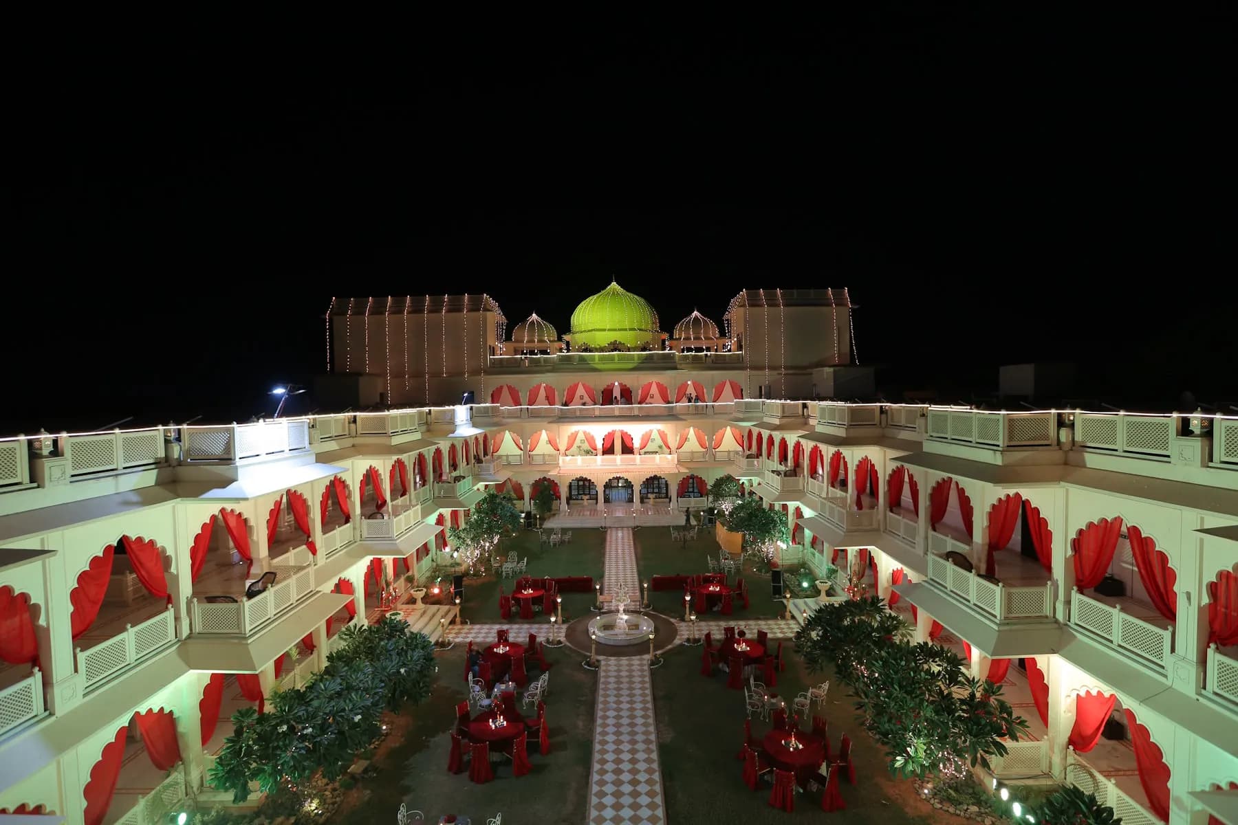 Open-lawn reception setup against the white haveli backdrop at Anuraga Palace Ranthambore