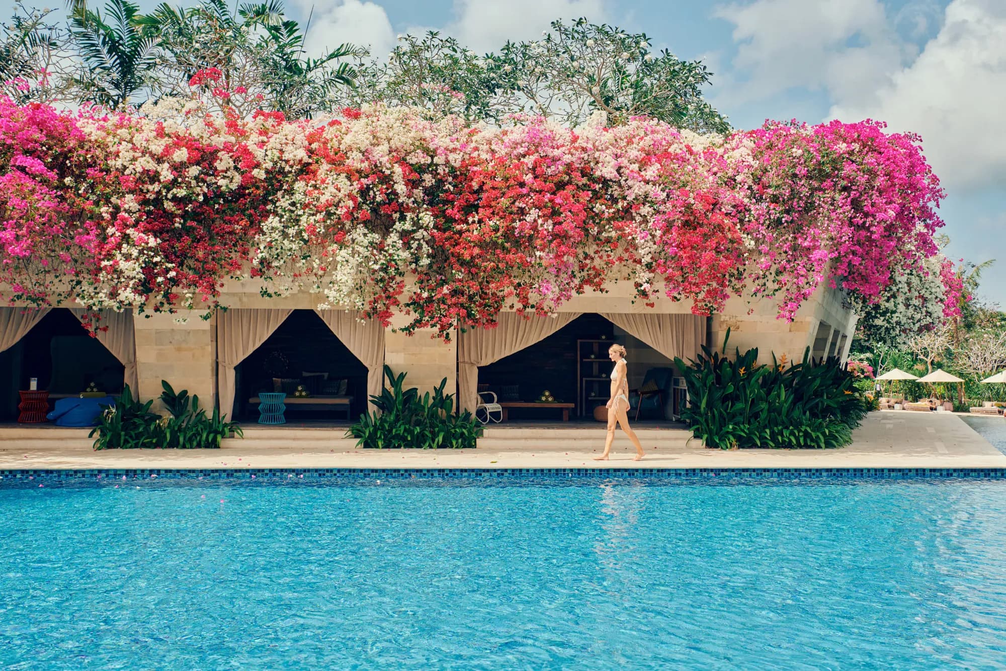 Pink bougainvillea draping a pavilion beside the swimming pool at AYANA Estate Bali, Jimbaran