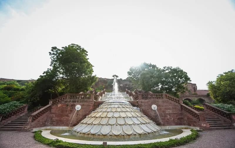 Poolside and heritage palace courtyard setting at Bal Samand Lake Palace Jodhpur