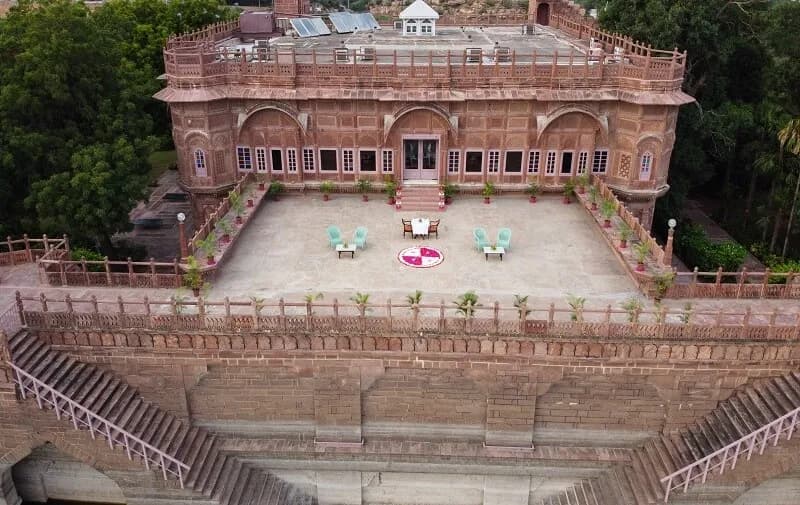 Bal Samand Lake, mango orchards and heritage palace views across the estate near Jodhpur