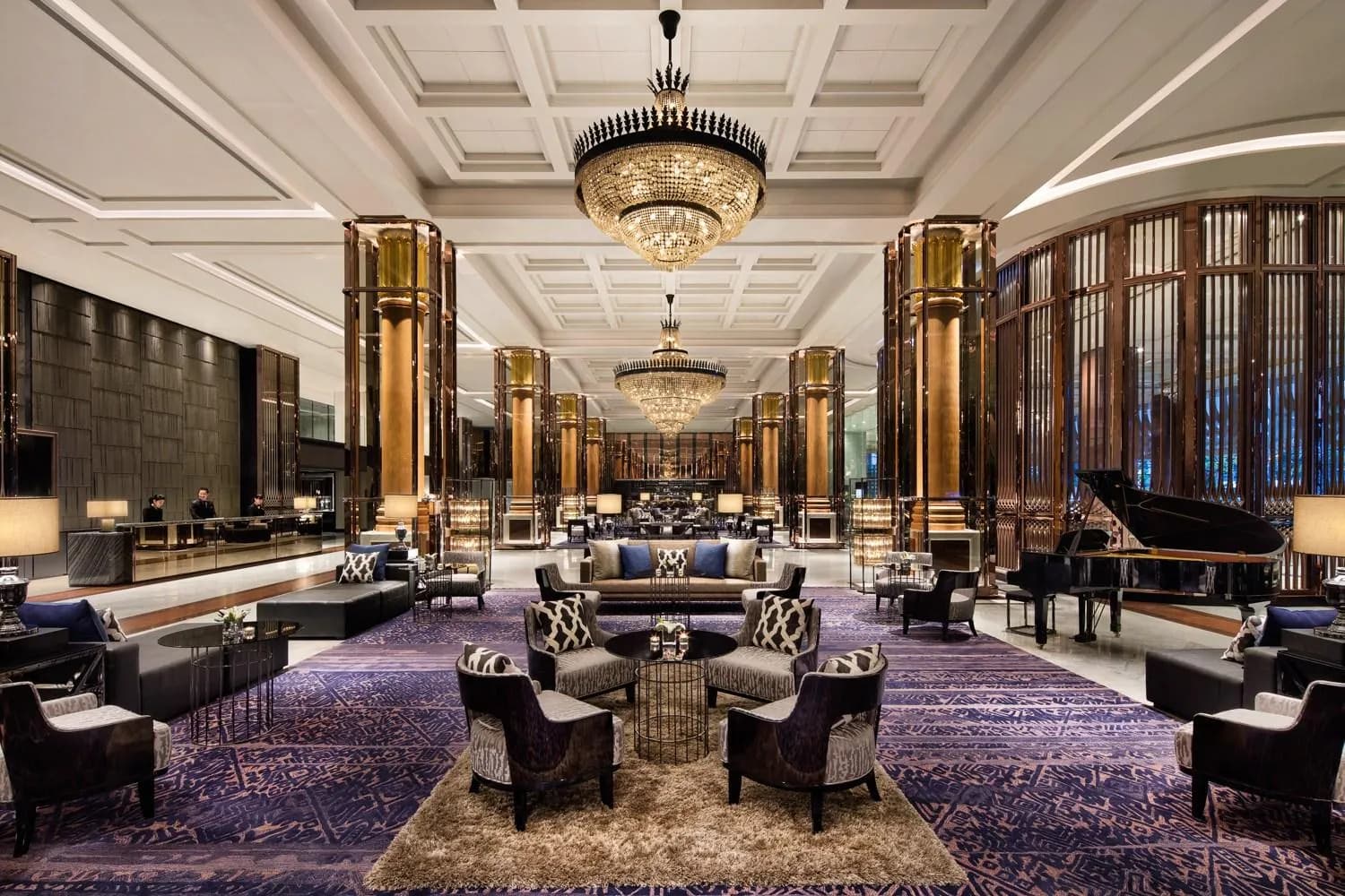 Grand lobby of Bangkok Marriott Marquis Queen's Park with crystal chandeliers, gold columns and a grand piano