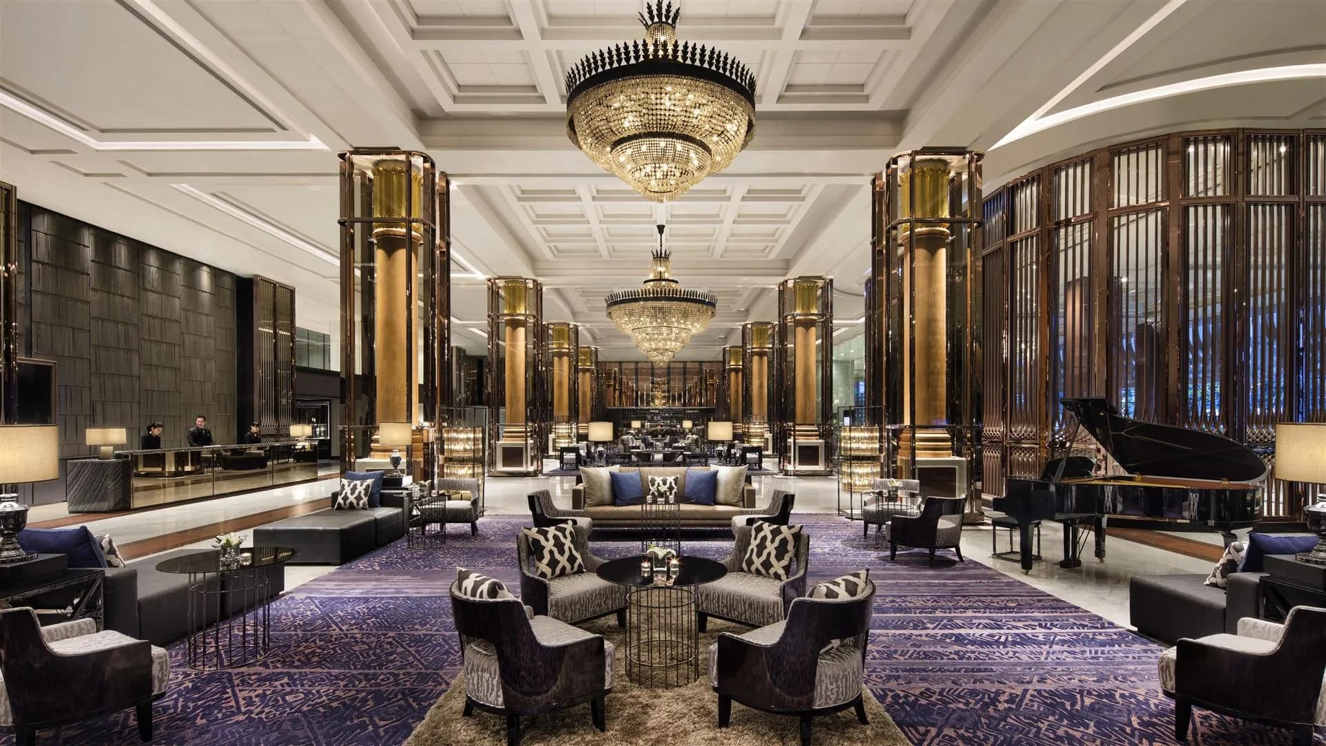 Grand arrival lobby and lounge with crystal chandeliers and gold columns at Bangkok Marriott Marquis Queen's Park