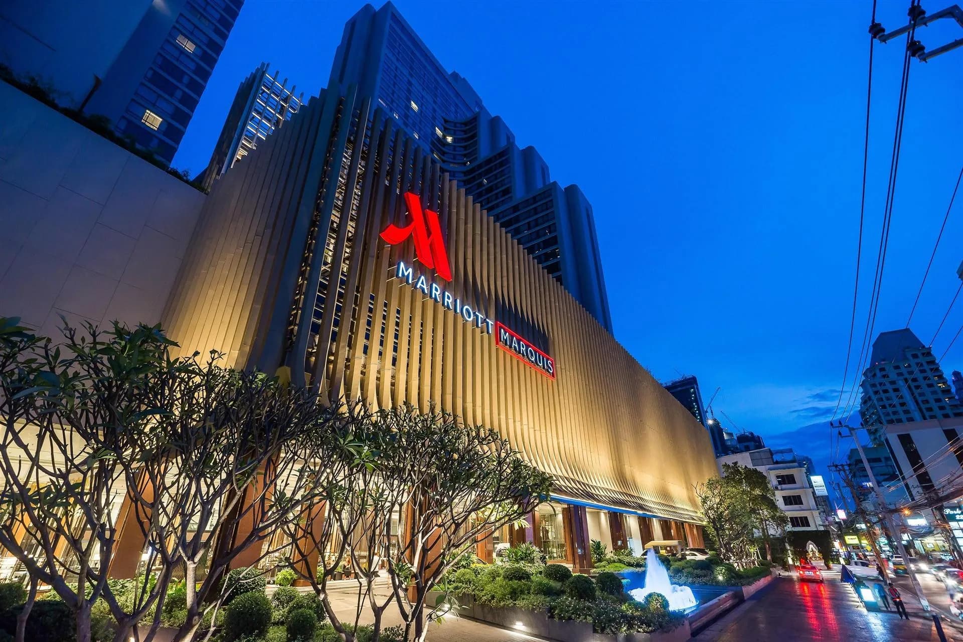 Illuminated exterior facade of Bangkok Marriott Marquis Queen's Park tower at night on Sukhumvit, Bangkok