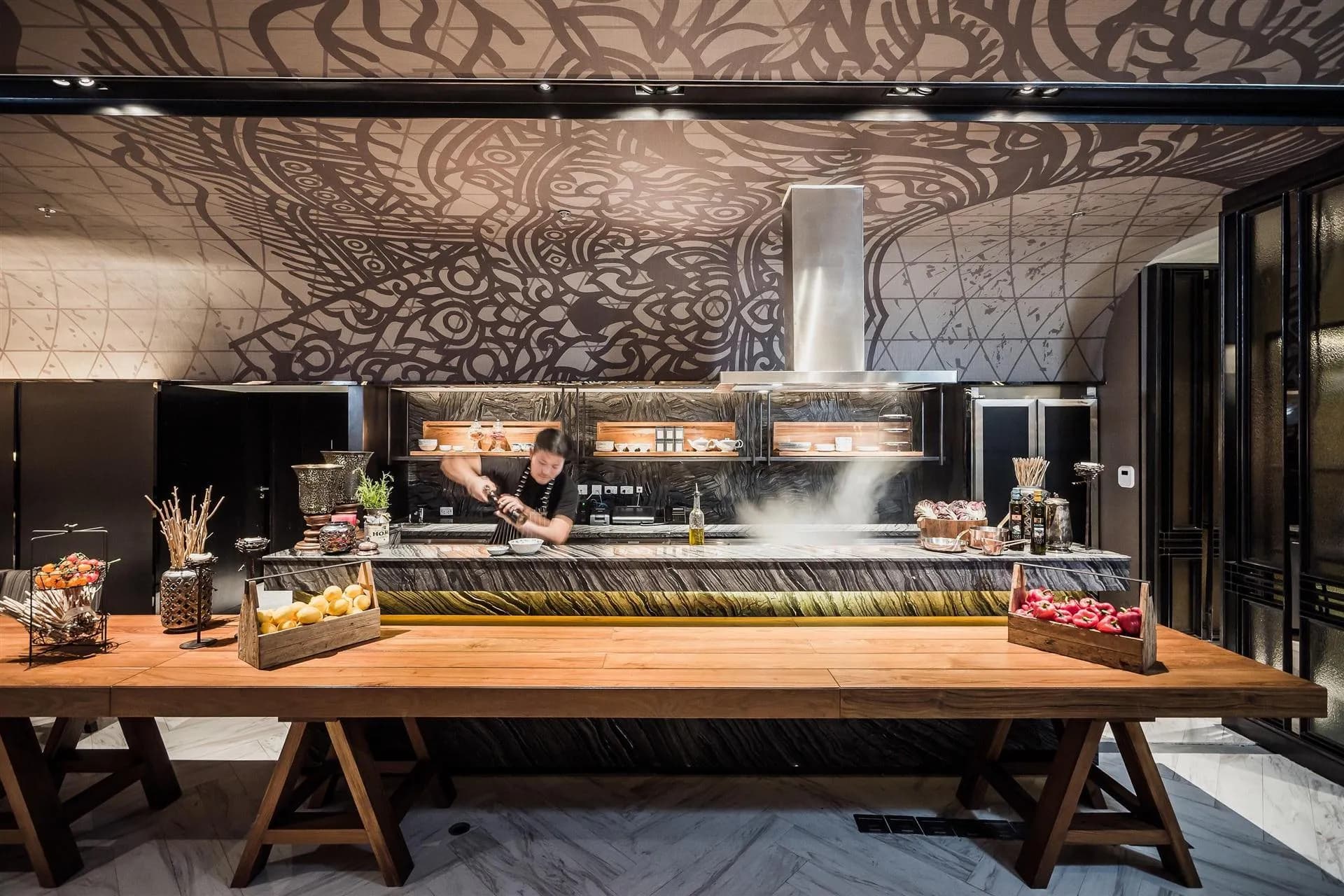 Live cooking and grilling counter beneath a hand-drawn Thai mural at Bangkok Marriott Marquis Queen's Park