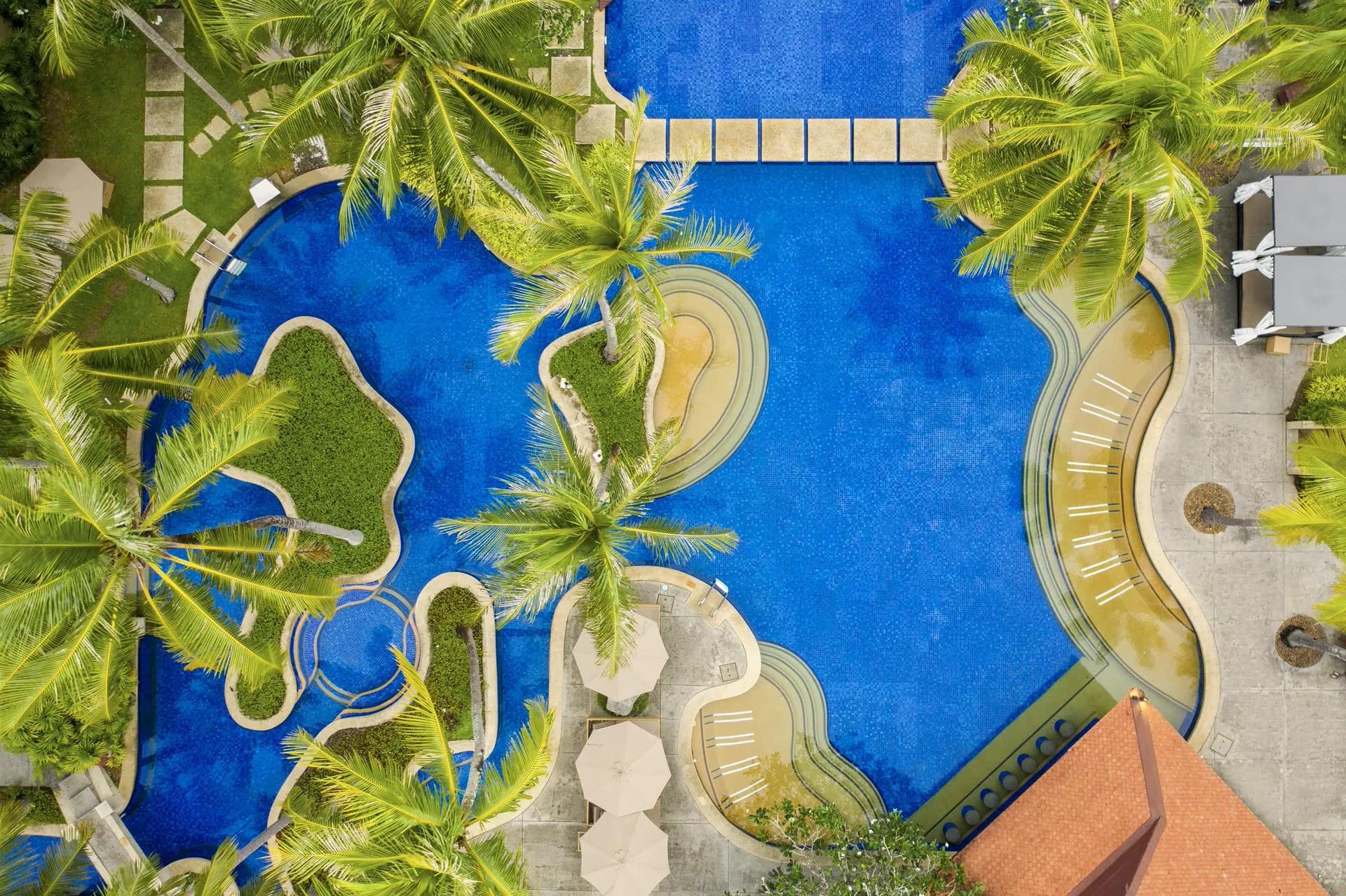 Aerial of grand lagoon pool villas at Banyan Tree Phuket at golden hour, Thailand