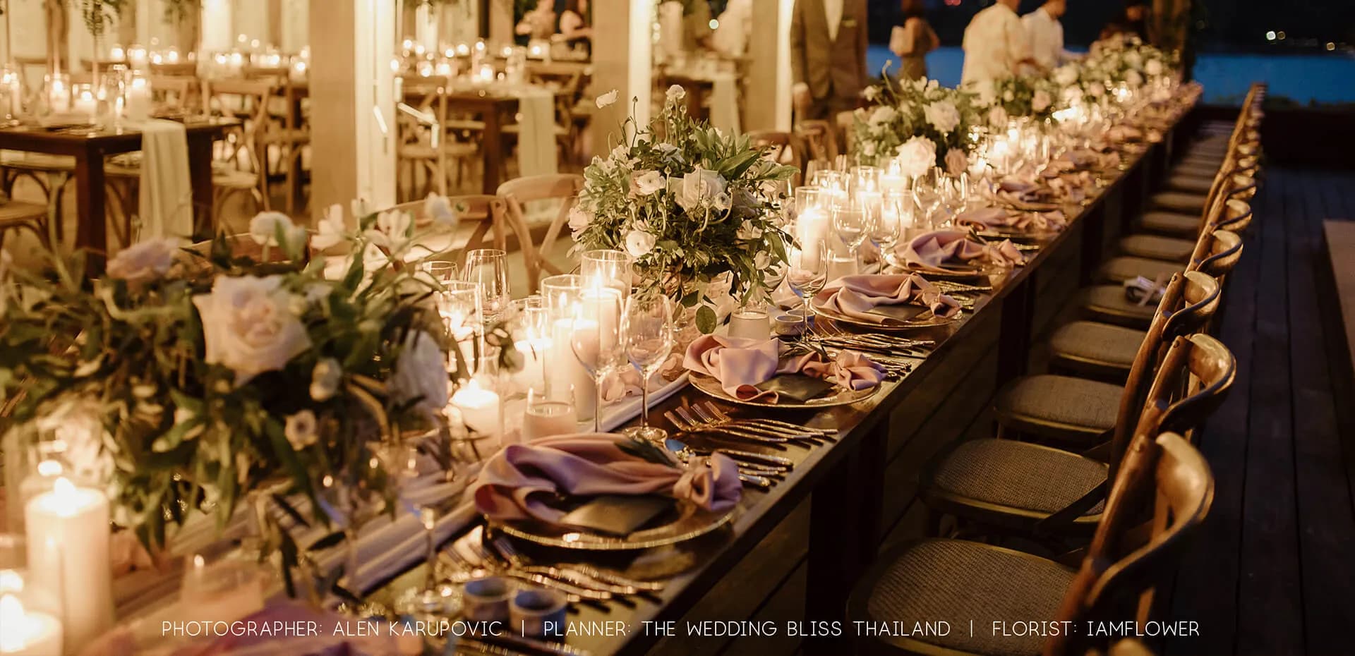 Cape Fahn fairy-lit terrace dinner setting under canopy greenery for an evening celebration over the Gulf of Thailand