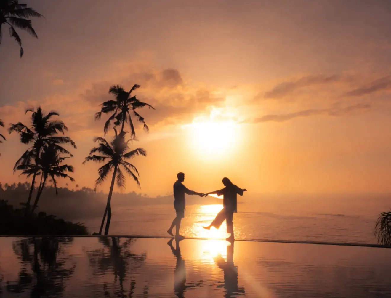 Clifftop promontory wedding ceremony setting at sunset above the ocean at Cape Weligama, Sri Lanka