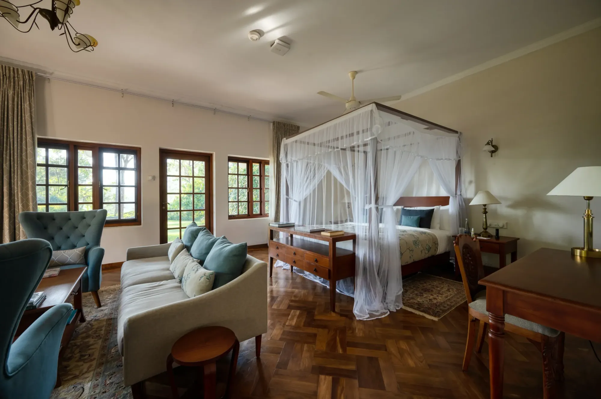 Master suite with four-poster bed in a restored planters' bungalow at Ceylon Tea Trails Sri Lanka