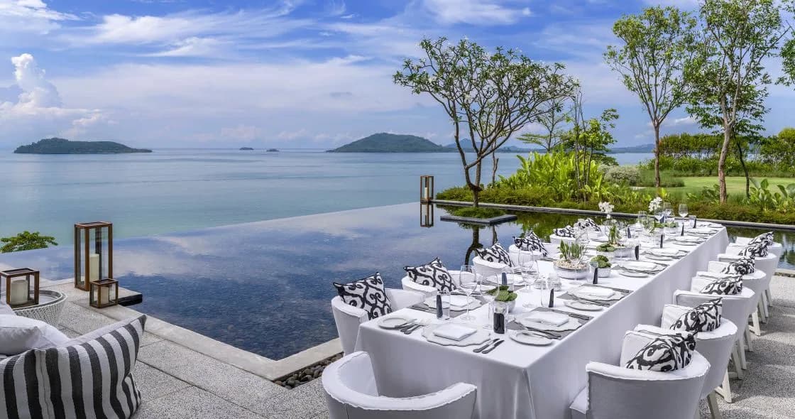Ocean-view restaurant table and refined COMO Cuisine plating at COMO Point Yamu Phuket