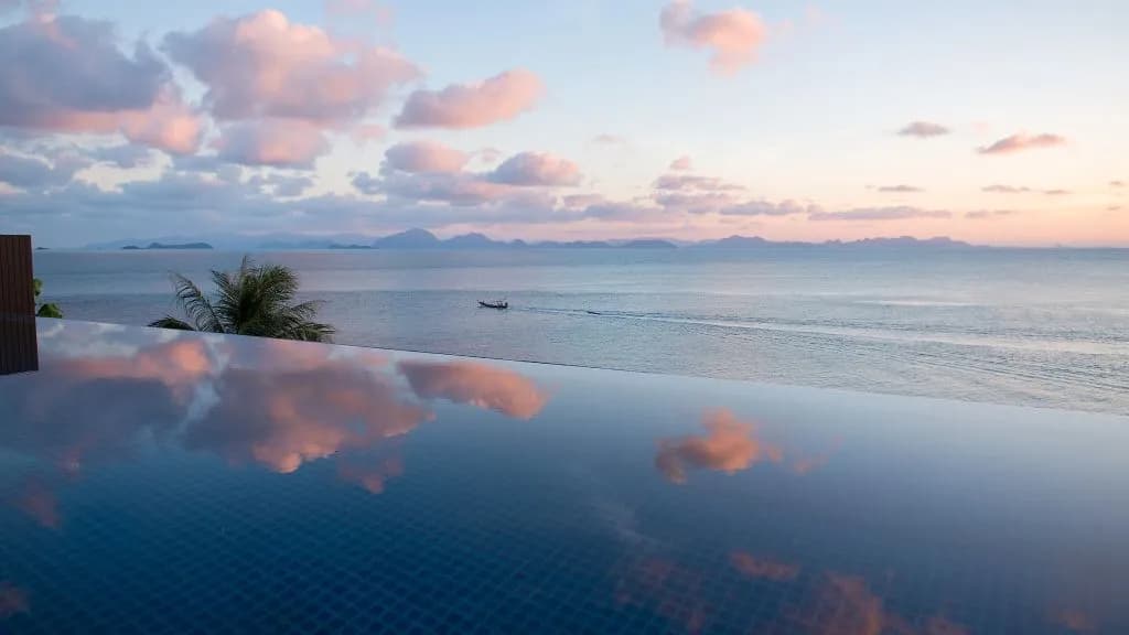 Sunset over an ocean pool villa facing the Five Islands at Conrad Koh Samui, Koh Samui