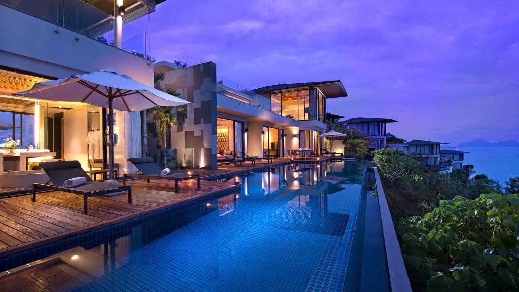Three-bedroom pool villa with a large infinity pool and deck for a private celebration at Conrad Koh Samui