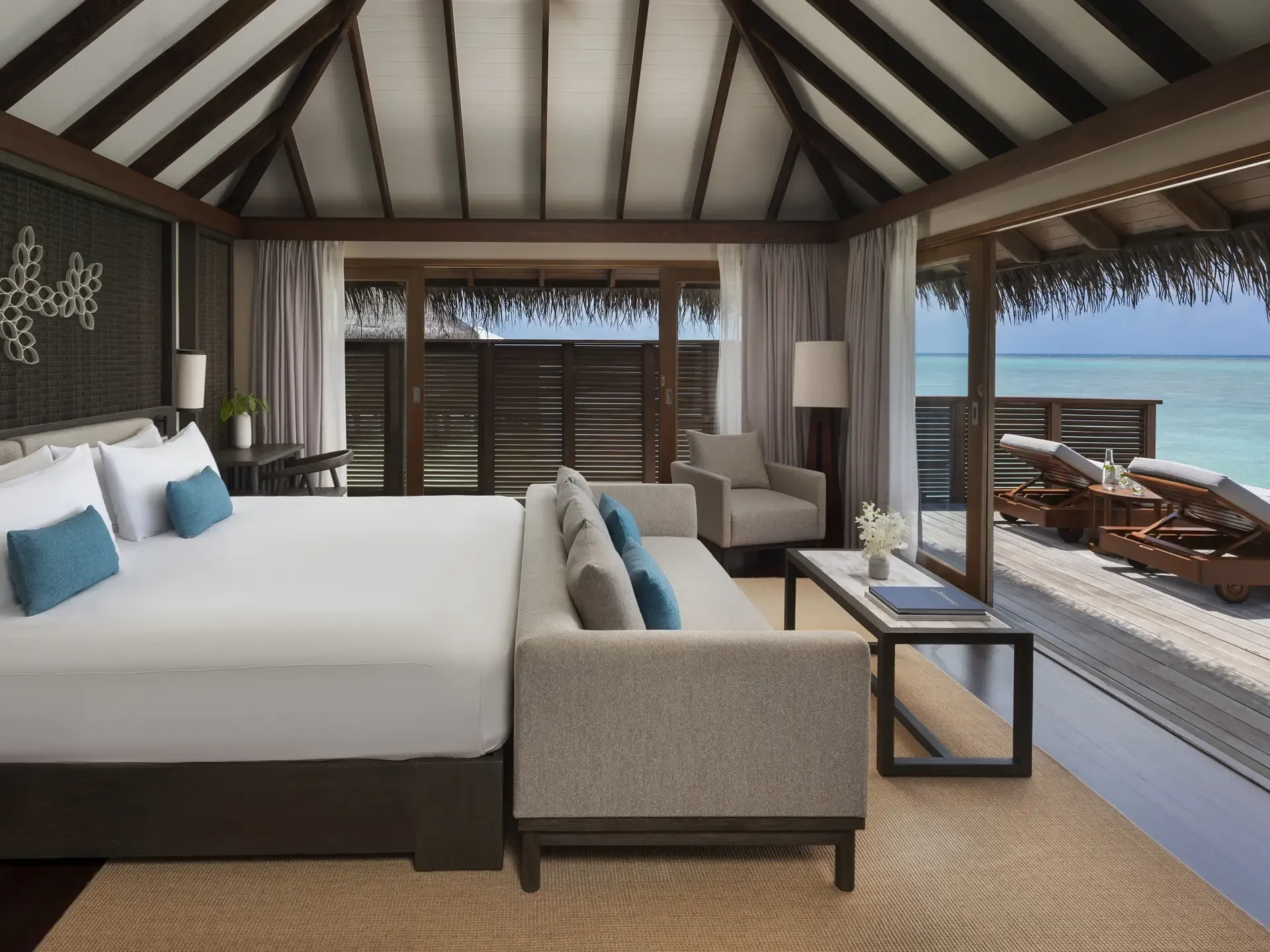 Over-water villa with private infinity pool and sundeck over the lagoon at Conrad Maldives Rangali Island