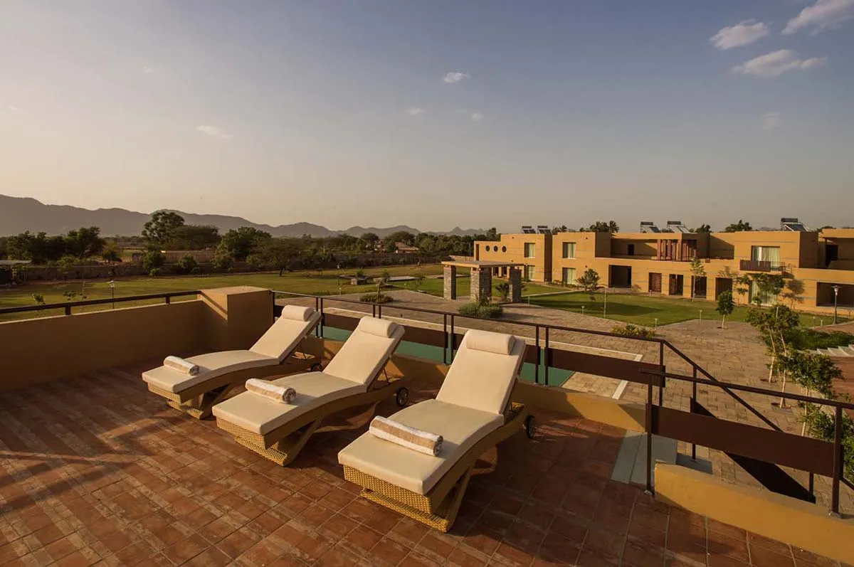 Evening sundowner sangeet celebration on the pool deck at Dera Masuda Pushkar