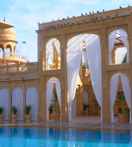 Evening sangeet celebration on the lit central lawns at Fort Rajwada Jaisalmer
