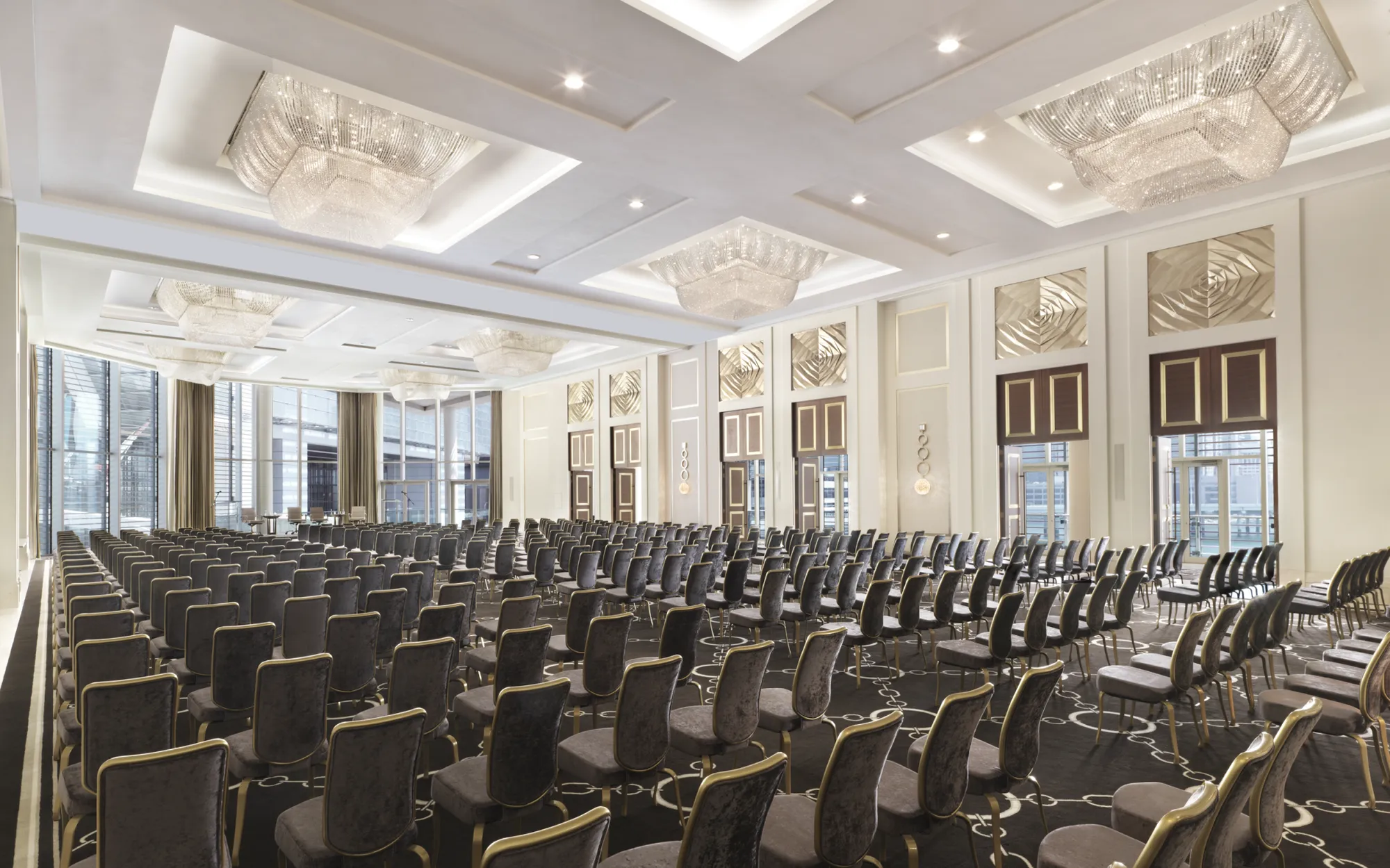 Grand ballroom at Four Seasons Abu Dhabi set theatre-style with crystal chandeliers for a ceremony