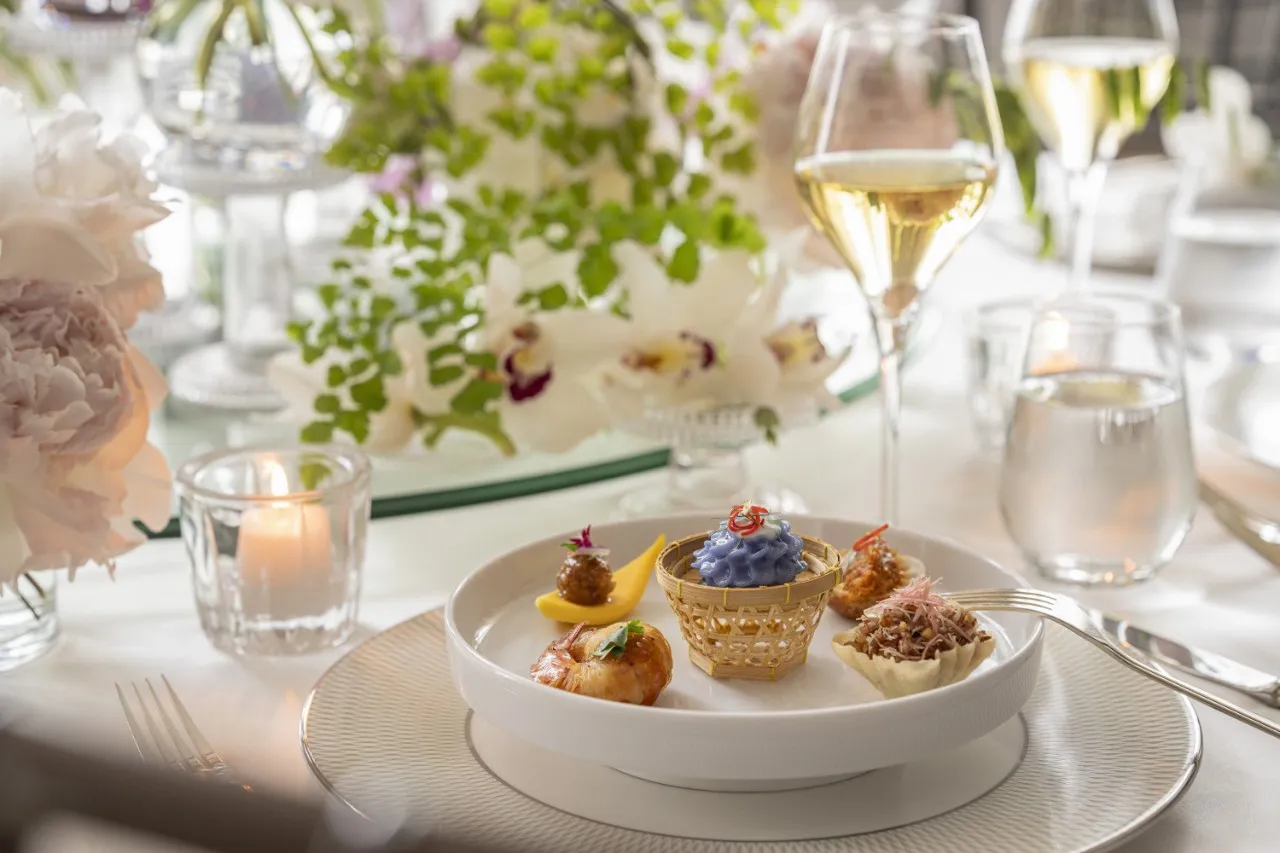 Plated wedding canapés with champagne and peony florals at Four Seasons Hotel Bangkok