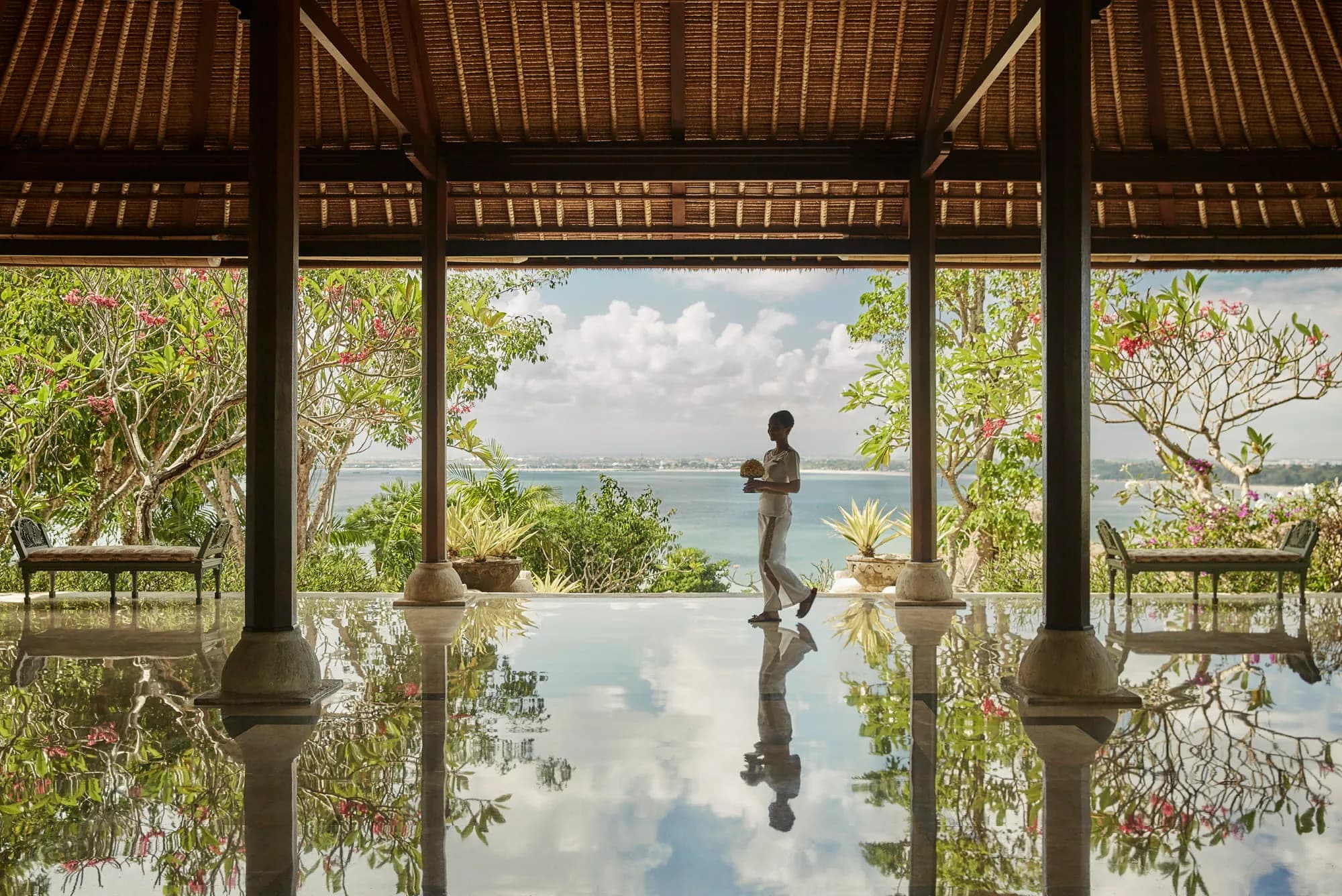 Four Seasons Resort Bali at Jimbaran Bay thatched-roof private-pool villa in a walled Balinese courtyard above Jimbaran Bay