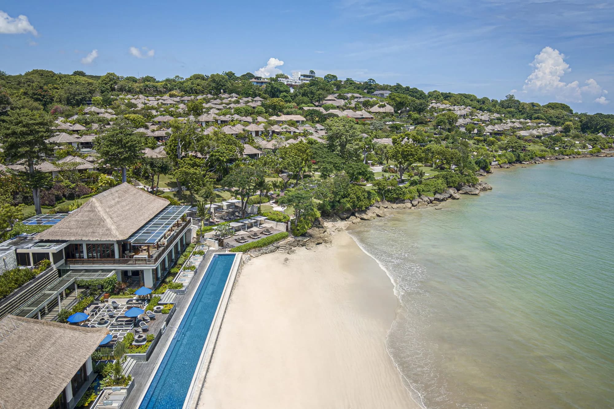 Four Seasons Resort Bali at Jimbaran Bay private-pool villa interior and Balinese courtyard pool with Jimbaran Bay sea view