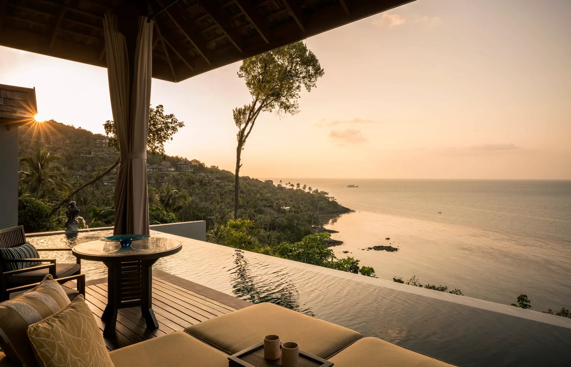 Four Seasons Resort Koh Samui sunset wedding ceremony on the secluded private cove beach below the hillside villas