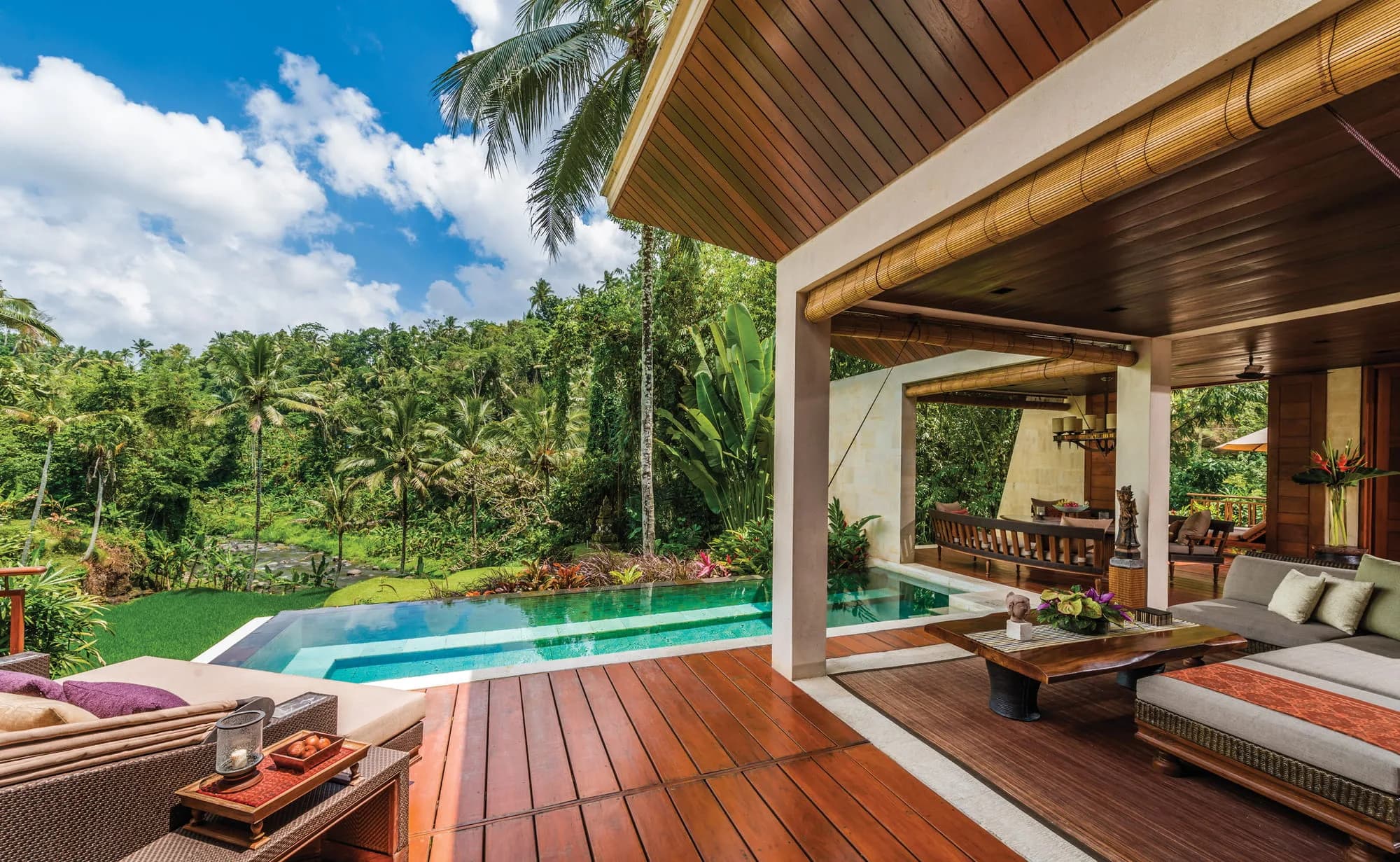 Teak suspension bridge arrival walkway leading into Four Seasons Resort Bali at Sayan over the Ayung River gorge Ubud Bali