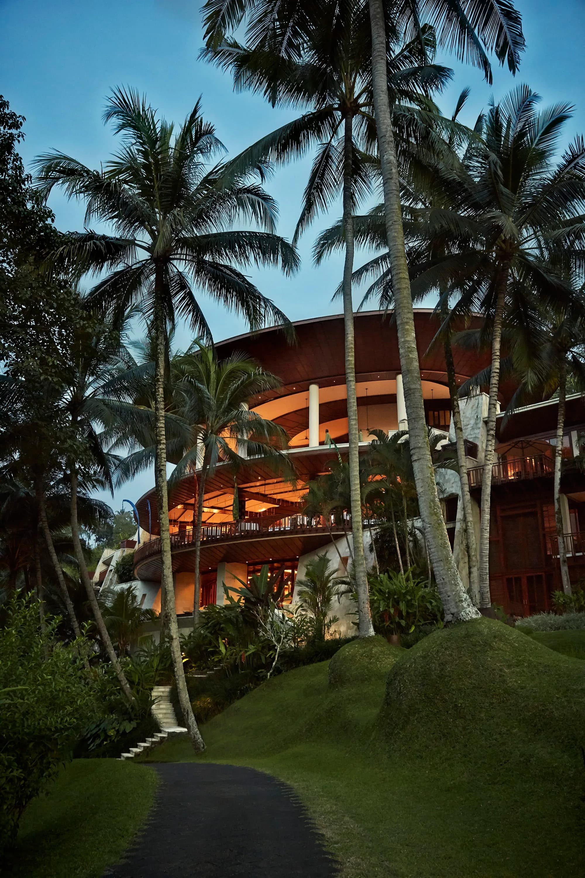 Aerial exterior of Four Seasons Resort Bali at Sayan wrapped around the green Ayung River gorge with rainforest near Ubud Bali