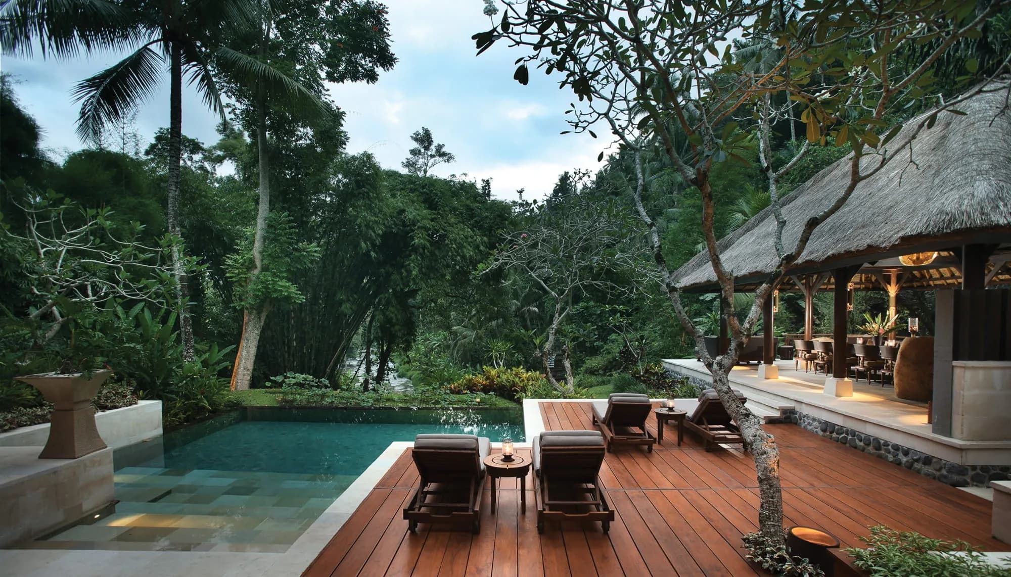 Riverside fine-dining table set over the Ayung River gorge at Four Seasons Resort Bali at Sayan Ubud Bali
