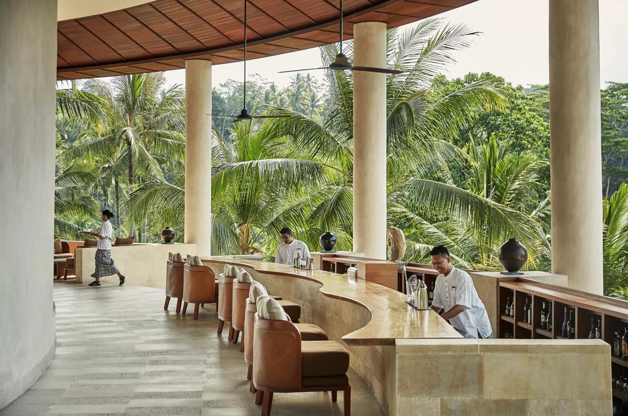 Four Seasons Resort Bali at Sayan lit up around the green Ayung River gorge at dusk near Ubud Bali