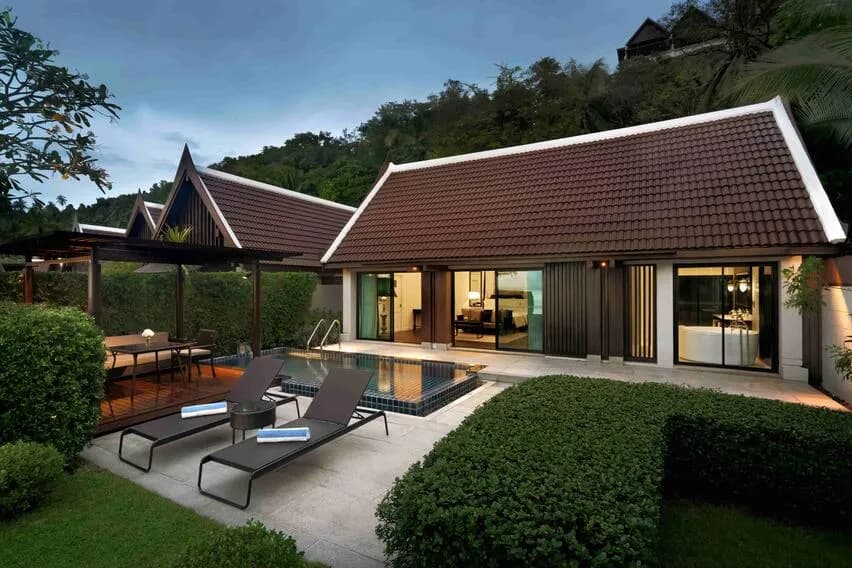InterContinental Koh Samui Resort tiered hillside and private beach glowing at golden hour over the Gulf of Thailand, Taling Ngam