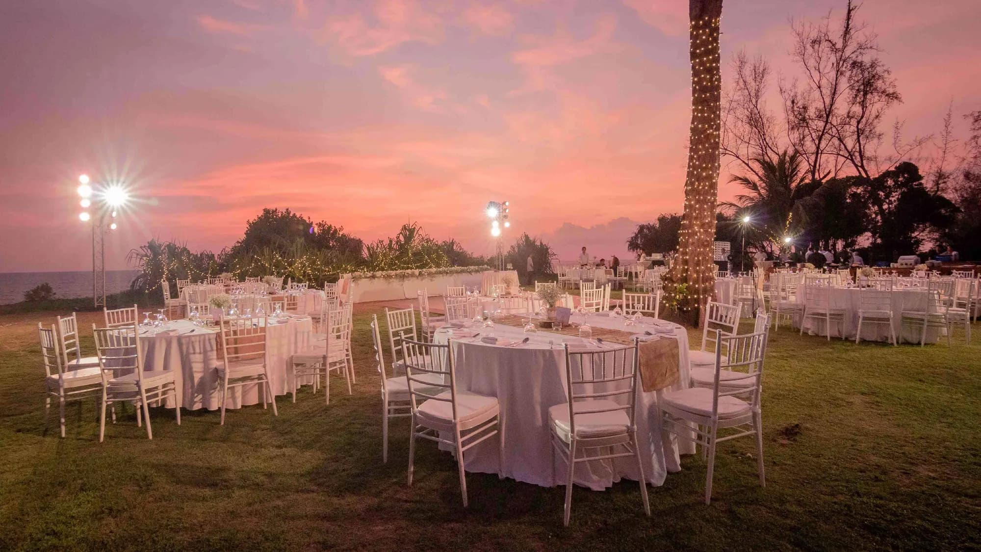 Al-fresco beachfront event and dinner setup at dusk at JW Marriott Phuket Resort & Spa, Mai Khao