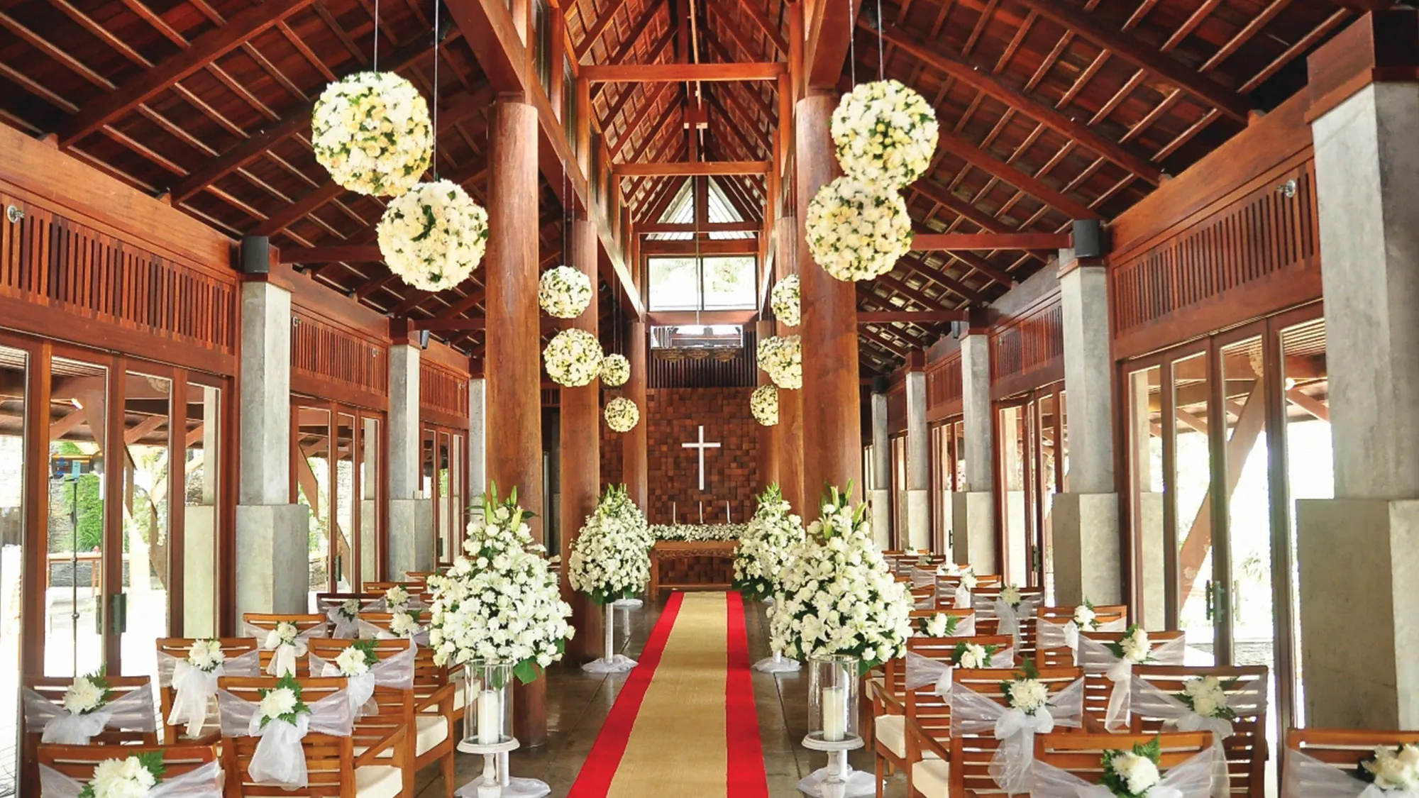 Glass seaside wedding chapel with panoramic Andaman Sea views at JW Marriott Phuket Resort & Spa