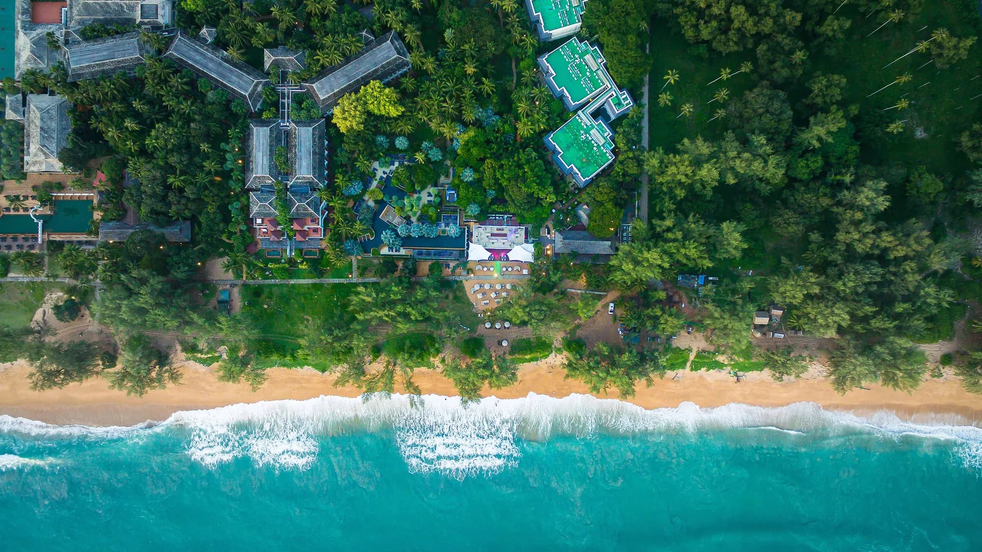 Aerial of the Andaman beachfront, pools and gardens at JW Marriott Phuket Resort & Spa, Mai Khao
