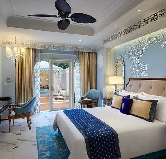 Carved jaali screens, archways and Rajput-Mughal architectural detail at The Leela Palace Jaipur