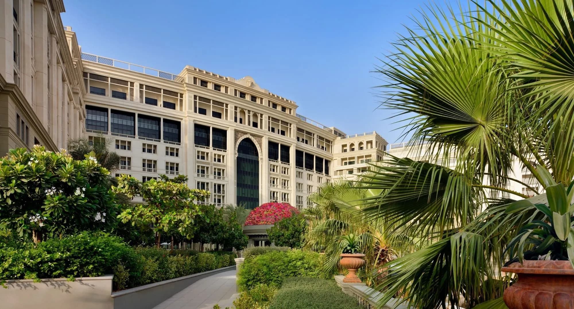 Palazzo Versace Dubai illuminated Italian-palace façade at night on Jaddaf Waterfront
