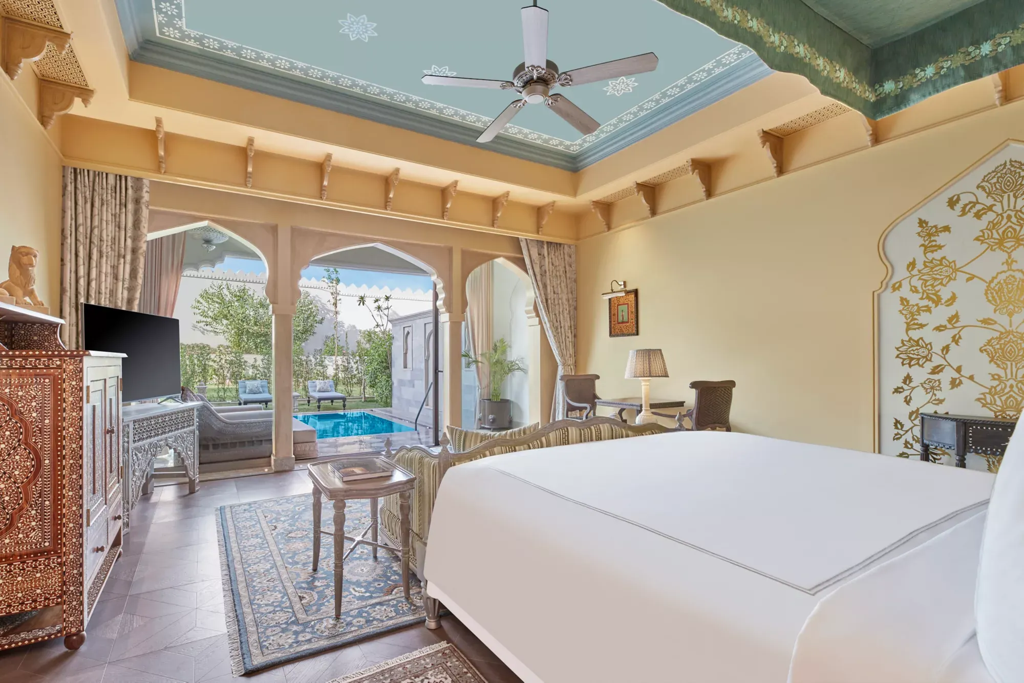 Handcrafted suite with golden murals and private plunge pool at Raffles Jaipur