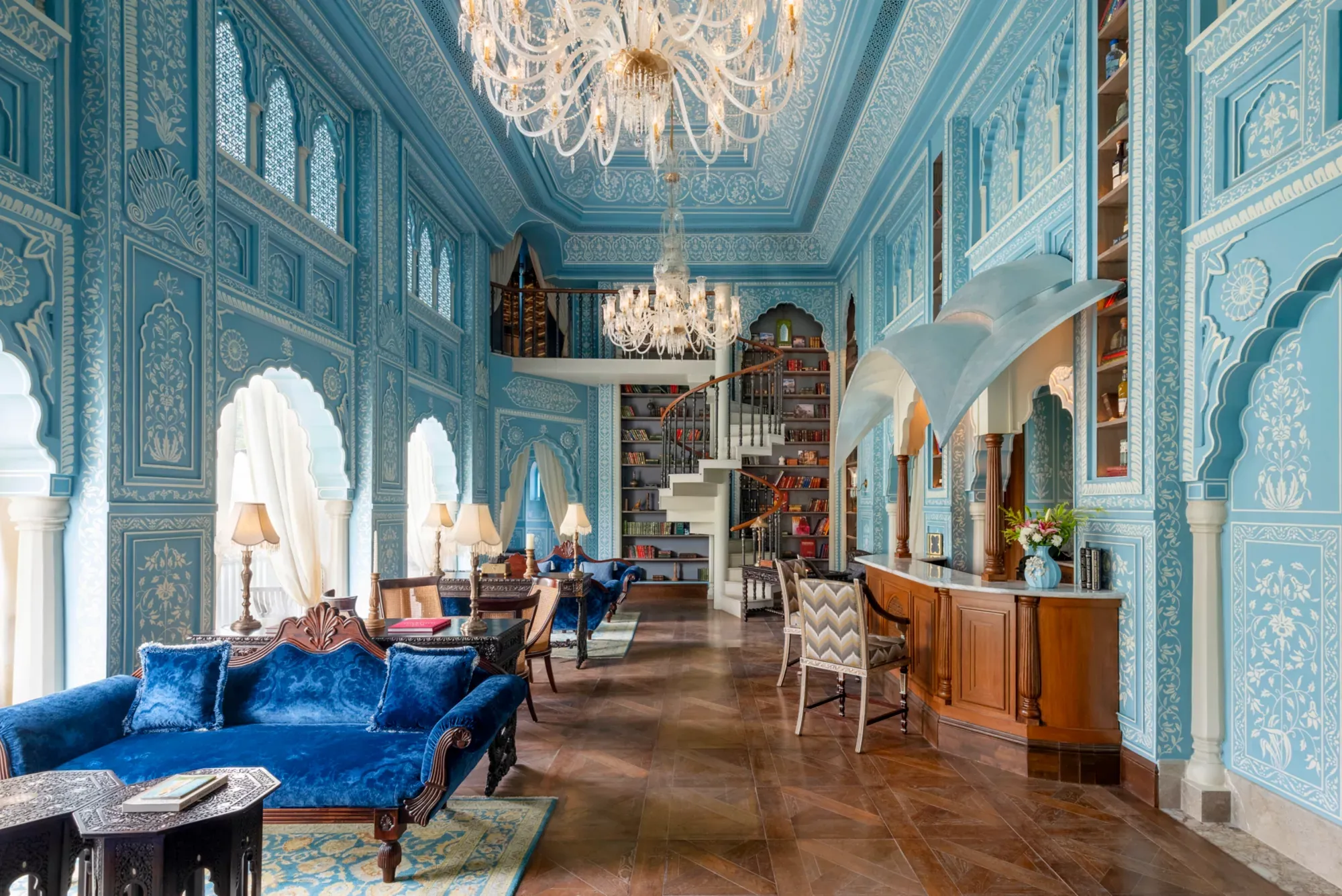 Hand-painted gilded murals and jaali screen detail at Raffles Jaipur