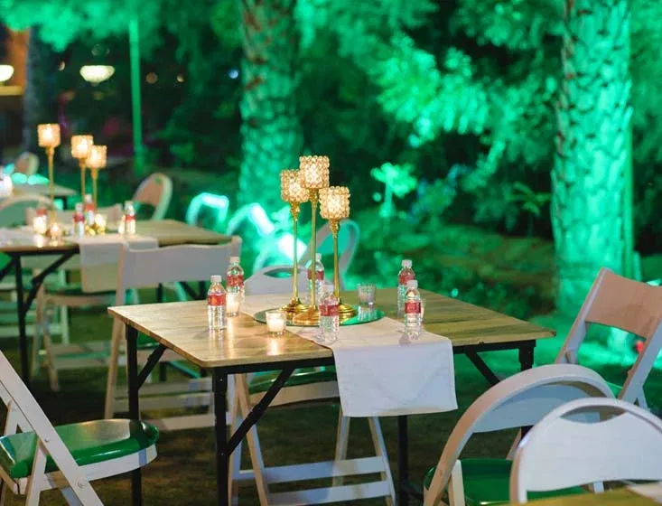 Evening sangeet celebration on the lit lawn and poolside at Hotel Rang Mahal, Jaisalmer